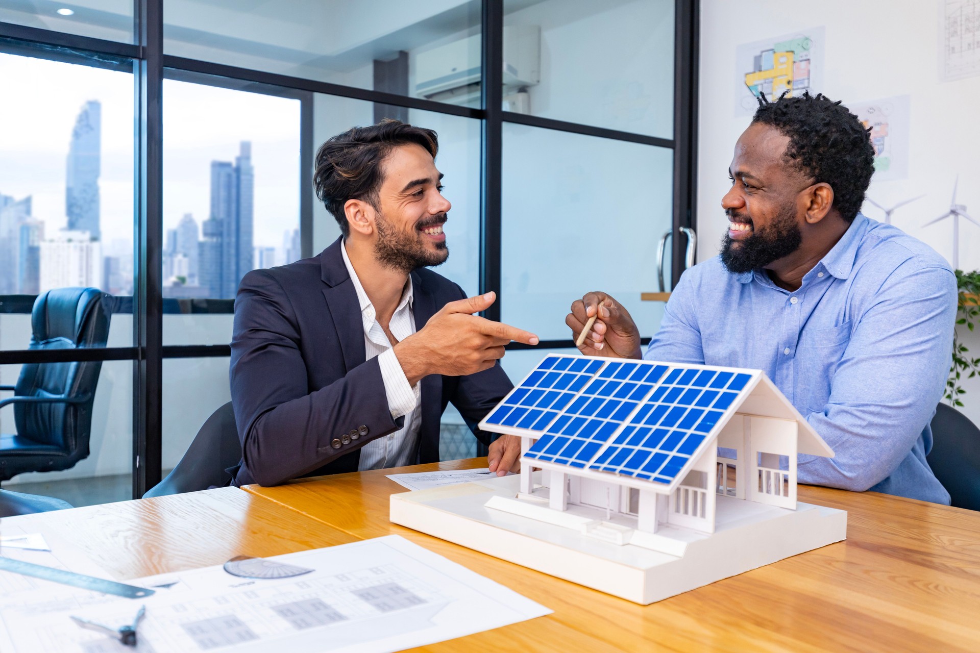Team of architecture and businessman are discussing and brainstorming on floor plan modification for real estate sustainable investment and solar energy housing development project