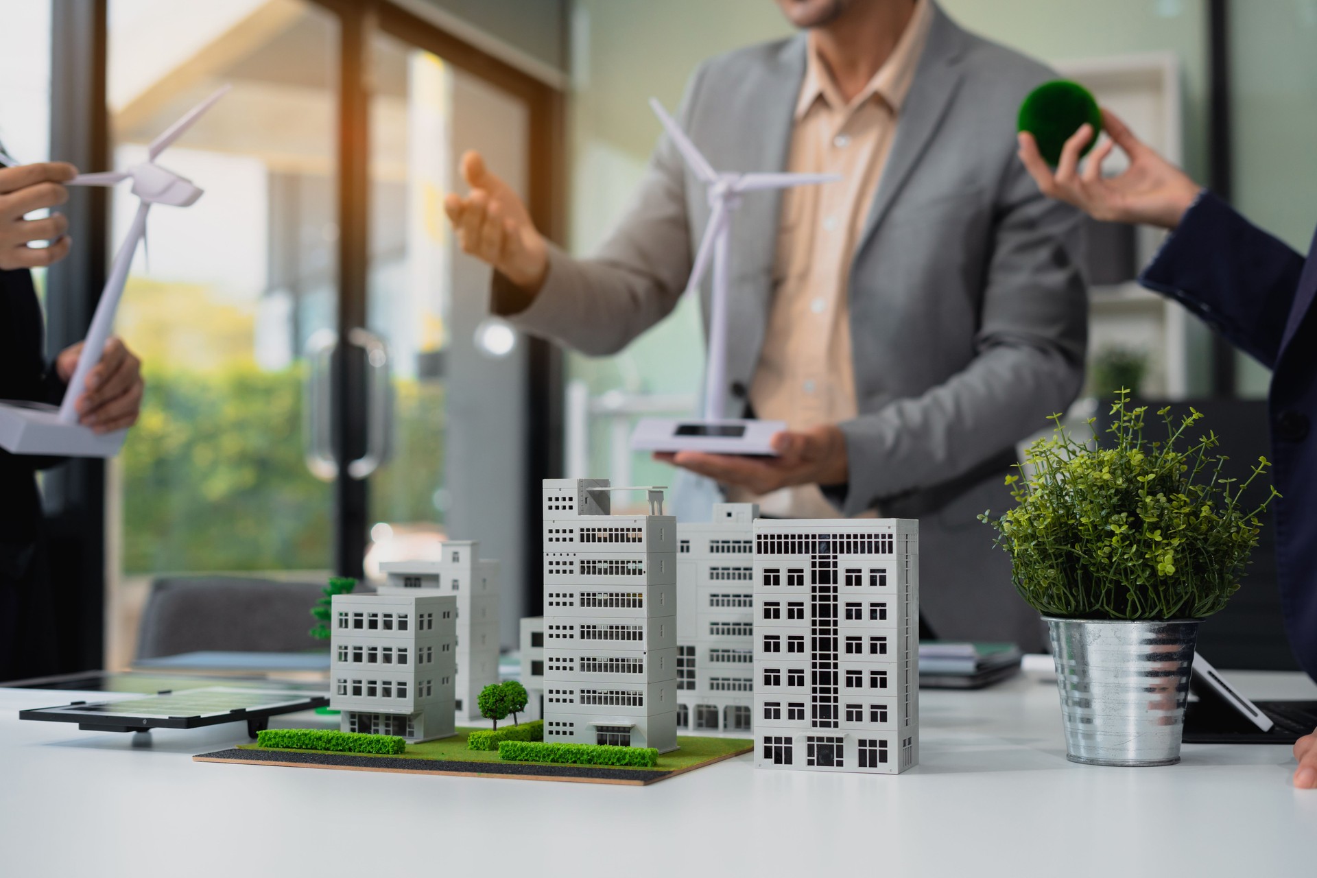 Engineer Teamwork Meeting, with partner on model building at company office working technology, Renewable energy-based green businesses and global warming.